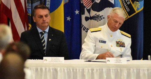 x87405098_Brazilian-President-Jair-BolsonaroC-sits-next-to-Commander-US-Southern-Command-Admiral-Crai.jpg.pagespeed.ic.yNm1cc-H_h